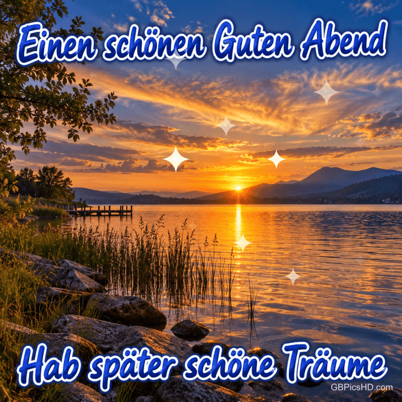 Sonnenuntergang am See mit Bergen, Schilf und Steg; die Grüße lauten "Einen schönen guten Abend" und "Hab später schöne Träume".